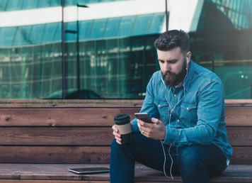 Image of a man on his phone